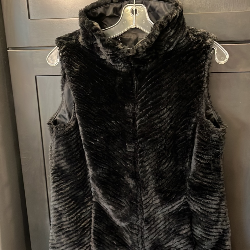 White House Black Market Black faux fur vest. Chevron pattern. Never worn Sm.
